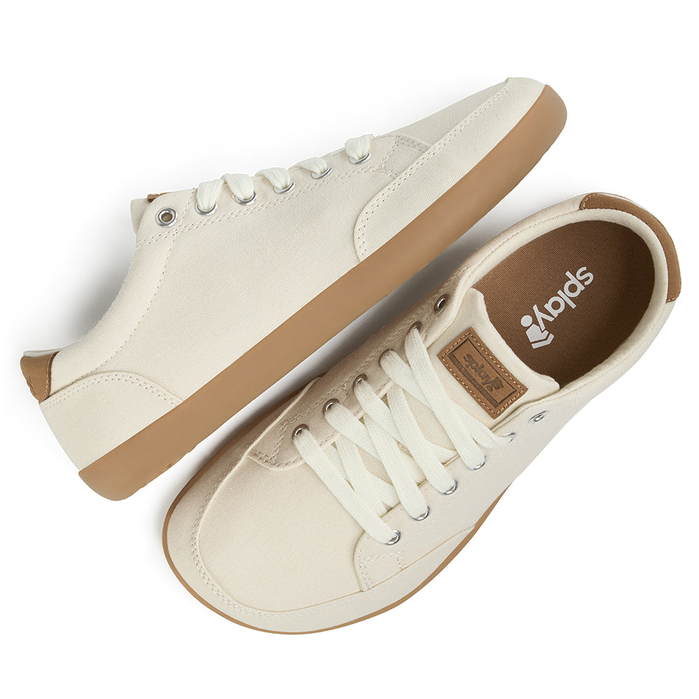 Pair of light tan FREESTYLE 3 Almond sneakers with brown gumsoles on a white background