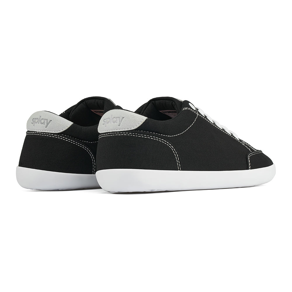 Back angle view of the FREESTYLE 3 Coal, Black sneaker with white laces on a white background. Shows details of the heel label and back panel of the shoe. 