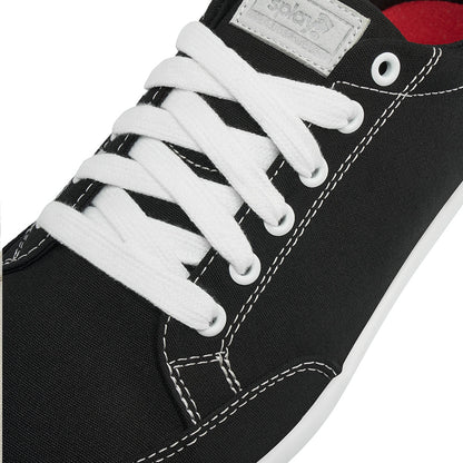 Close up view of the top and laces on the FREESTYLE 3 Coal, Black sneaker with white laces and light grey accents on a white background