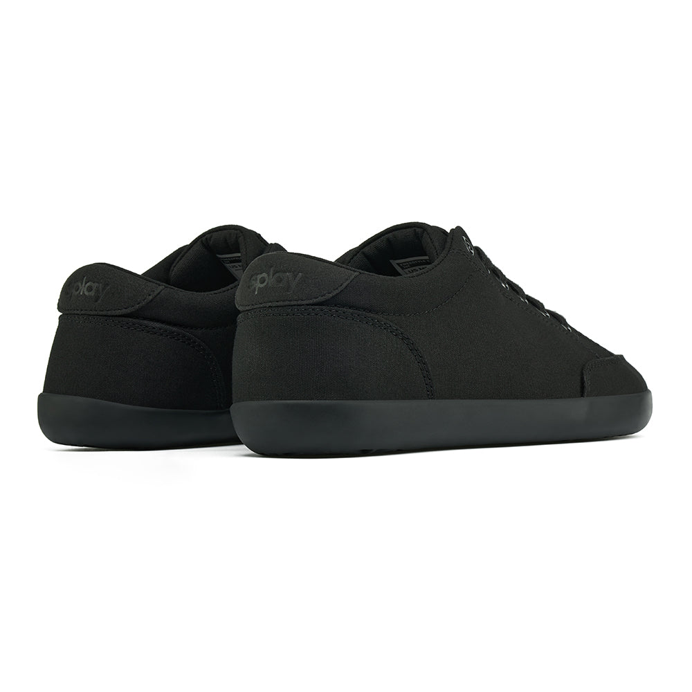 Back angle view of the FREESTYLE 3 Jet, Black sneaker with black laces, and black outsole on a white background. Shows details of the heel label and back panel of the shoe. 