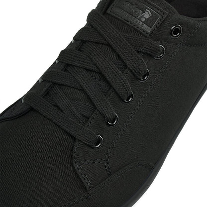 Close up view of the top and laces on the FREESTYLE 3 Jet, Black sneaker with black laces and black accents on a white background