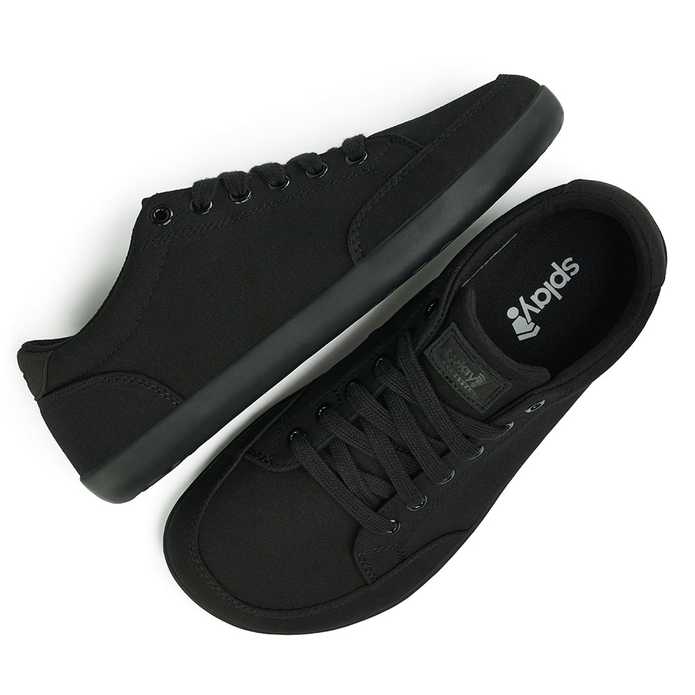 Top and Side view picture of the FREESTYLE 3 Jet, Black sneaker with black laces, and black outsole on a white background, shows black insole with the Splay logo.