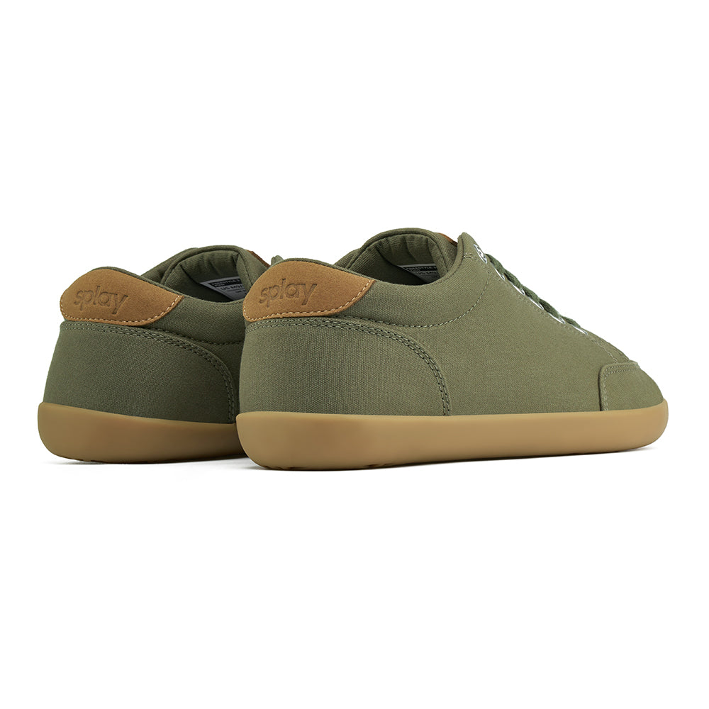 Back angle view of the FREESTYLE 3 Pine, Pine green sneaker with matching green laces, and brown gumsole on a white background. Shows details of the heel label and back panel of the shoe. 