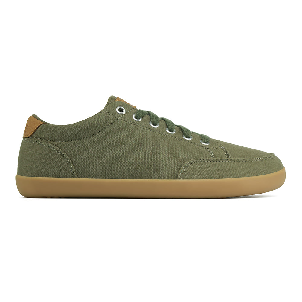 Side picture of the FREESTYLE 3 Pine, Pine green sneaker with matching green laces, and brown gumsole on a white background