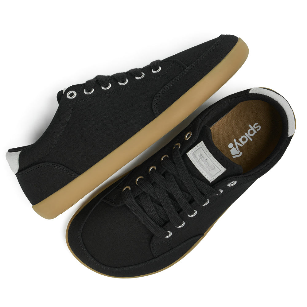 Top and Side view picture of the FREESTYLE 3 Shale, black sneaker with black laces, and brown gumsole on a white background, shows brown insole with the Splay logo.