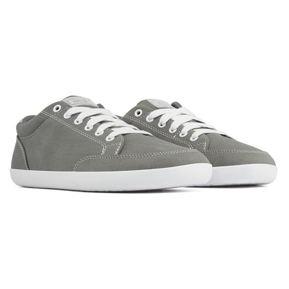 Front angle view of the FREESTYLE 3 Stone, grey sneaker with white laces, and white outsole, on a white background