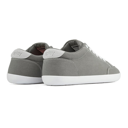 Back angle view of the FREESTYLE 3 Stone, grey sneaker with white laces, and white outsole on a white background. Shows details of the heel label and back panel of the shoe. 