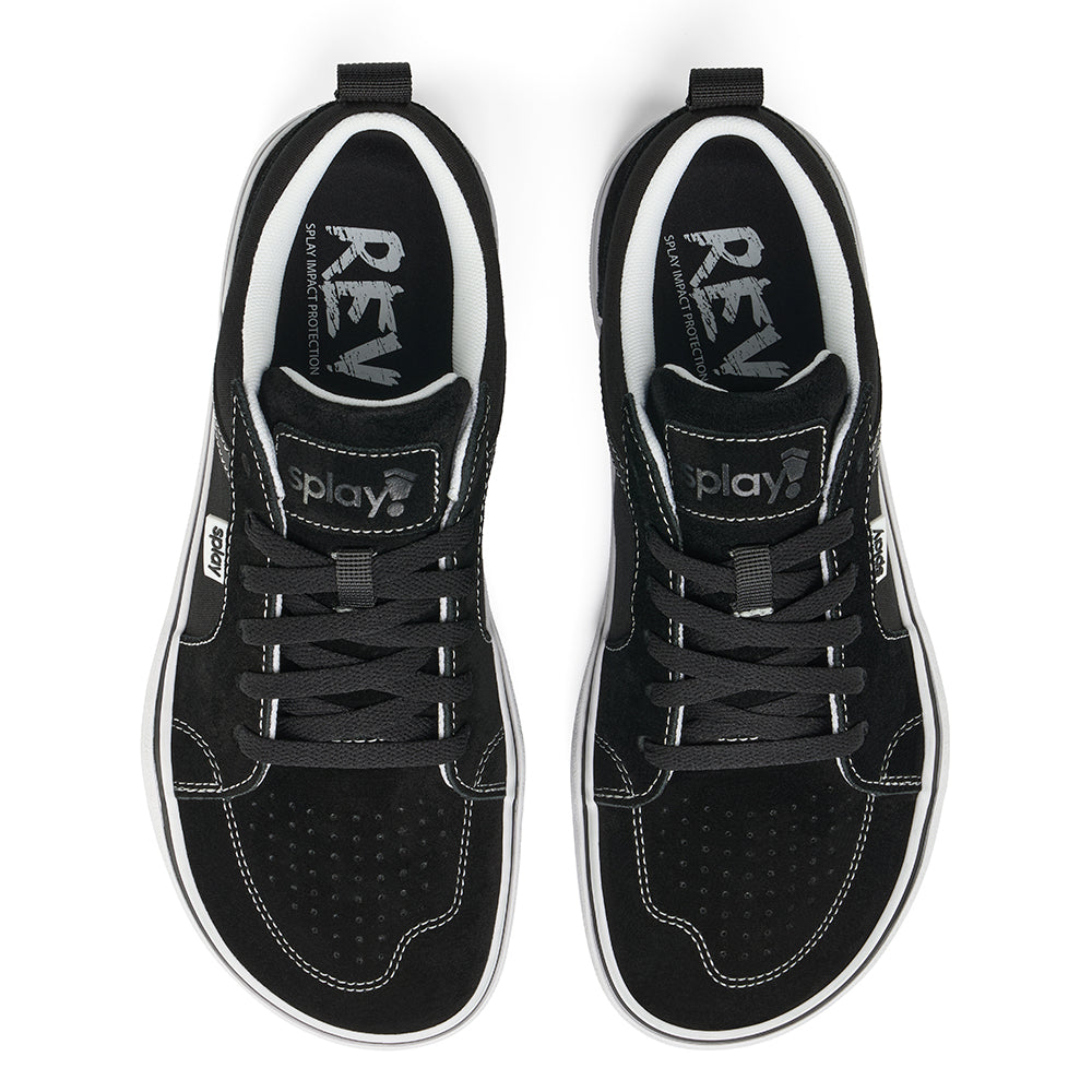 Over a white background, a pair of black REV LTS Los Angeles sneakers viewed from above, showing barefoot-wide toe box, white stitching over black canvas, and “Splay” branding on white over the tongue and side label and the "REV" logo printed on the sockliner. Black laces. 