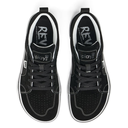 Over a white background, a pair of black REV LTS Los Angeles sneakers viewed from above, showing barefoot-wide toe box, white stitching over black canvas, and “Splay” branding on white over the tongue and side label and the "REV" logo printed on the sockliner. Black laces. 